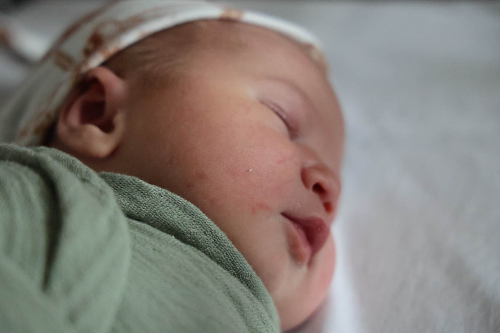 Soft close-up of Waylon against the swaddle